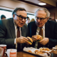 Warren_Buffet_and_Nouriel_Roubini_feeding_each_other_burgers-parody